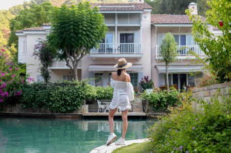 woman-walking-riverfront-luxury